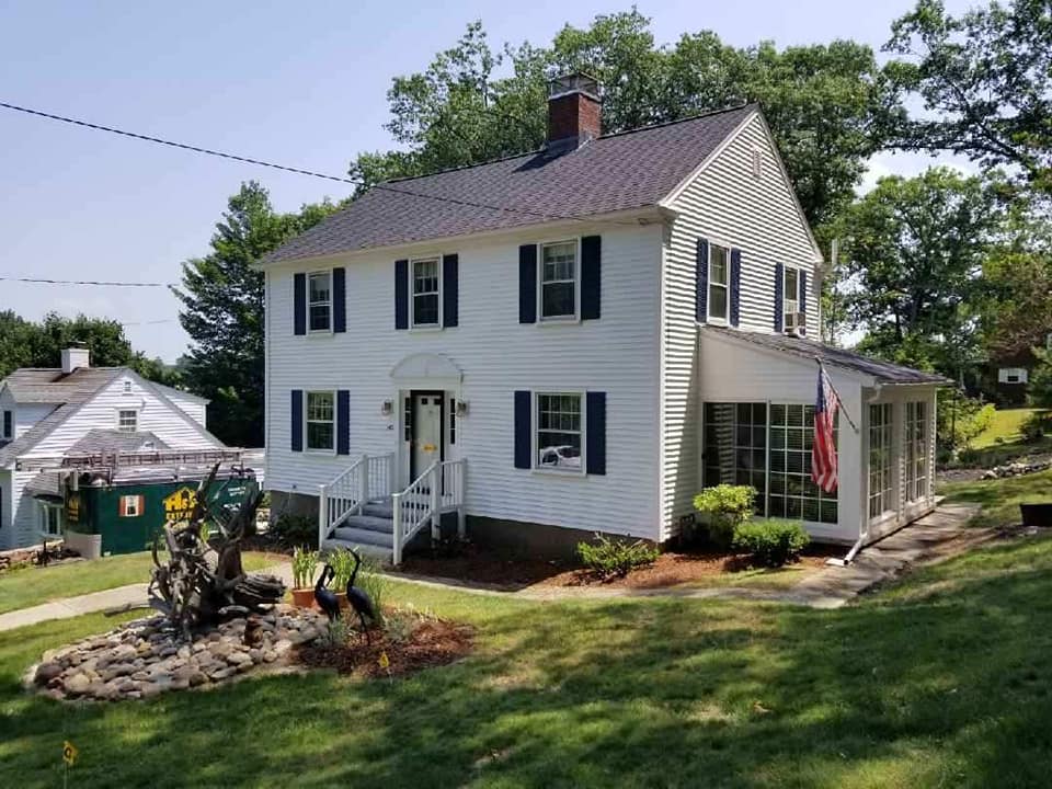 New Hampshire colonial home with new roofing and siding by H&H Exteriors